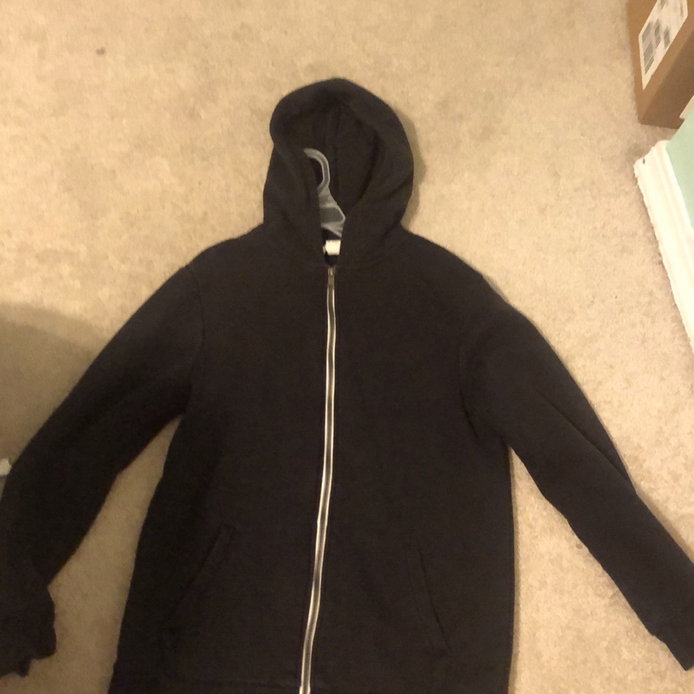 Simple black jacket with white zipper